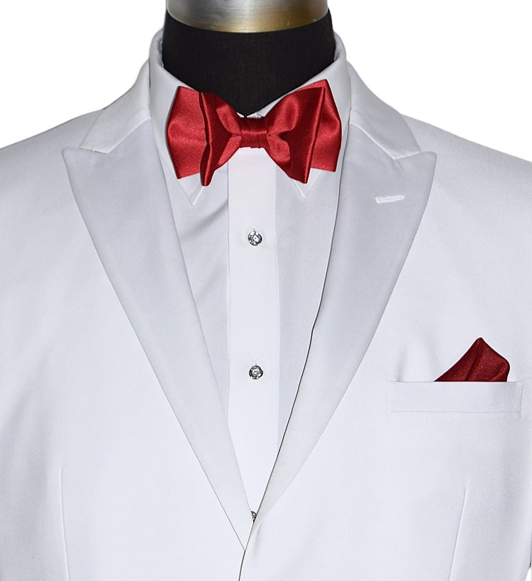 very close-front view white peak lapel tuxedo with red bow tie and pocket square on a white background