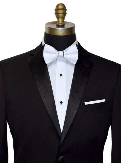 mannequin earing a black tuxedo with a white bowtie with black on the edges of the bowtie against a white background