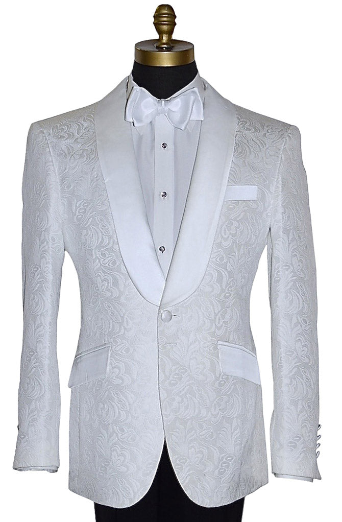 close-up mannequin wearing a white brocade tuxedo jacket with a white bowtie and black pants against a white background