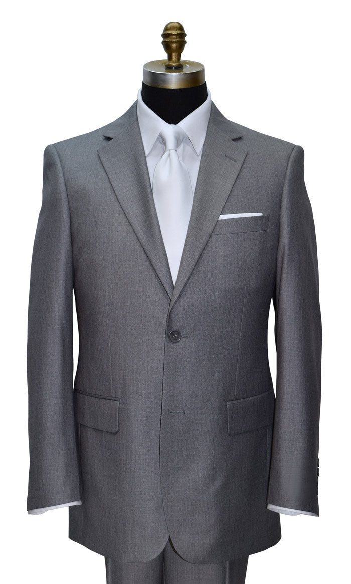 Gray suit on a mannequin with a white shirt and white low-sheen necktie and white pocket square against a white background