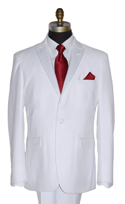 close-up life size mannequin wearing white peak lapel tuxedo with red neck-tie and pocket square on a white background