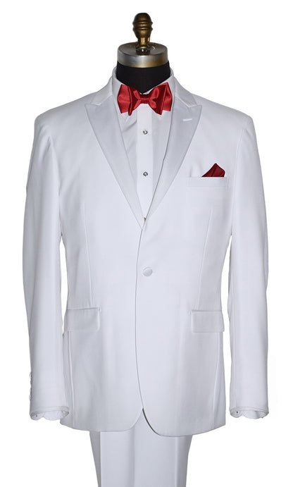 close-up life size mannequin wearing white peak lapel tuxedo with red bow tie and pocket square on a white background