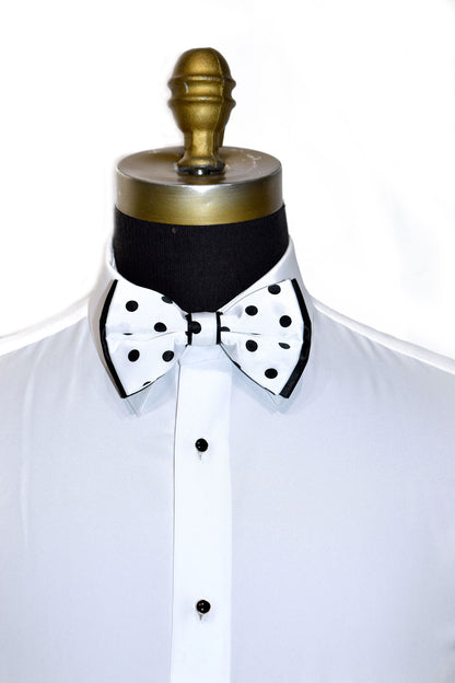 White shirt with a black and white polka dot bow tie on a mannequin against a white background