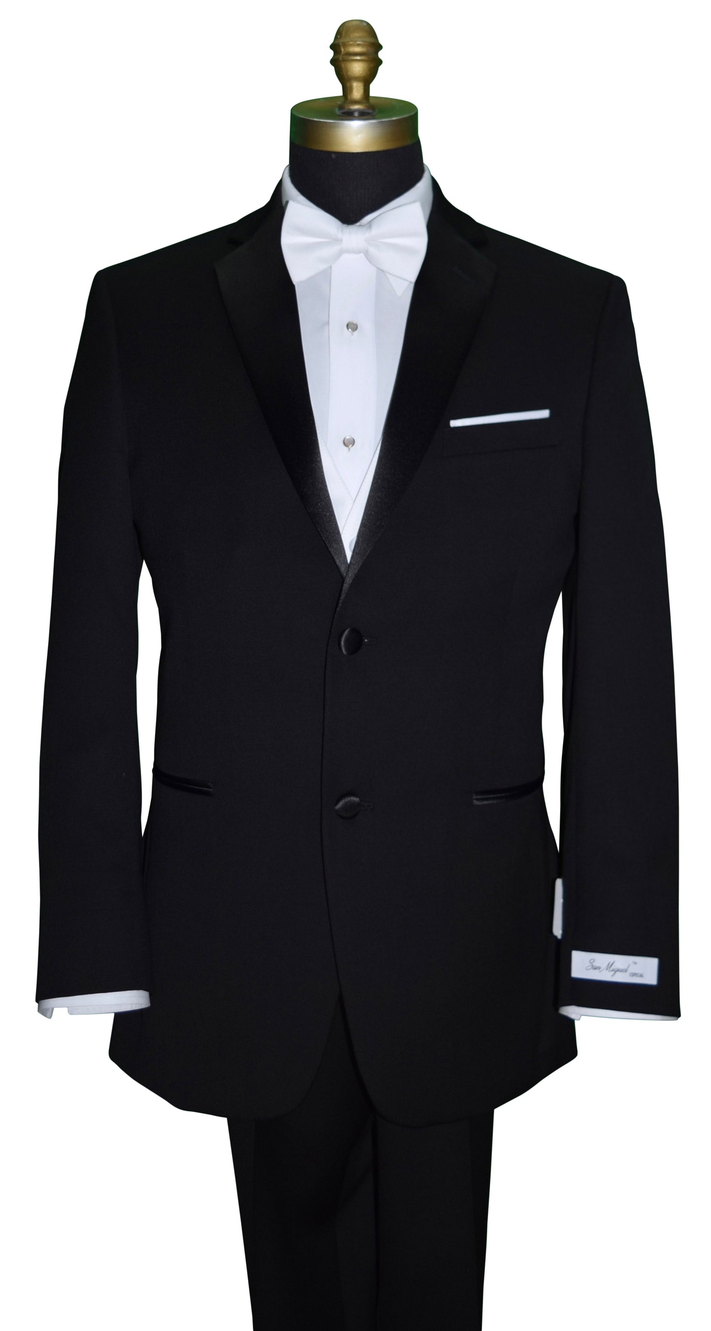 Black tuxedo with a white shirt and white satin vest and white bow tie on a mannequin against a white background