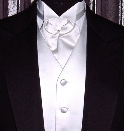 close-up mannequin wearing a black tuxedo with white satin vest and white satin ascot  in a store setting