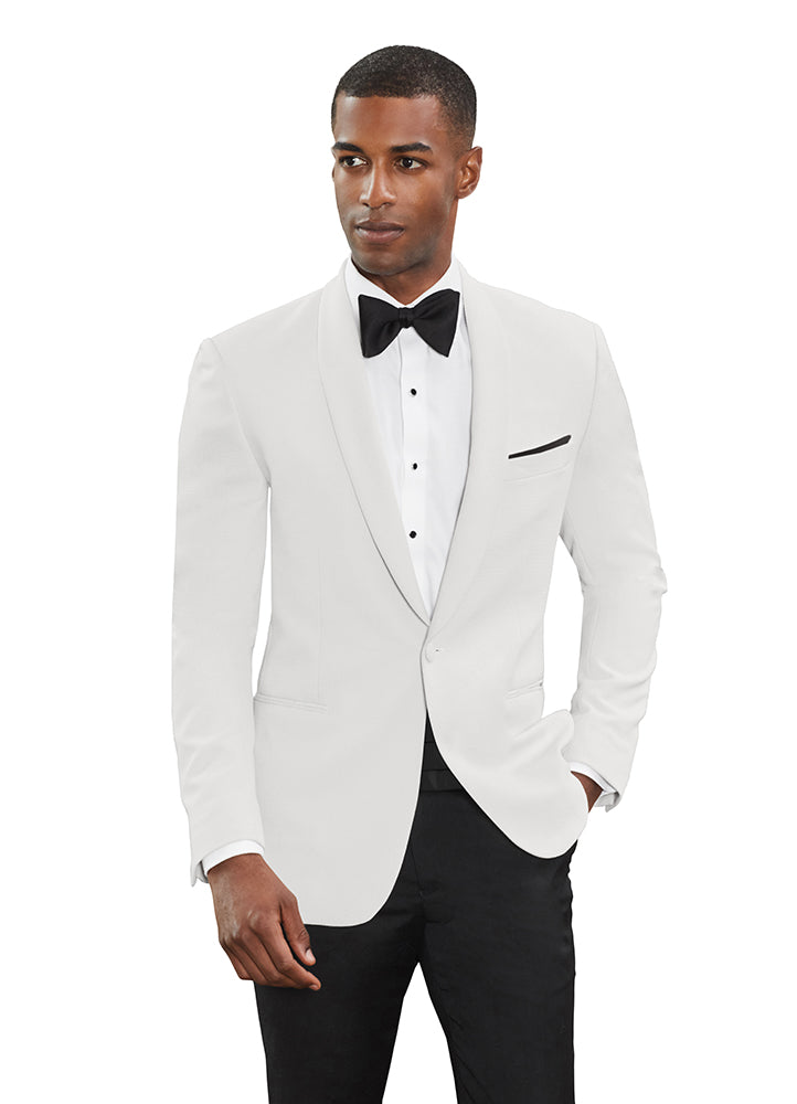 Man wearing a white shawl collar dinner jacket by tuxclub, with a black satin bowtie, and black tuxedo pants, against a white background.