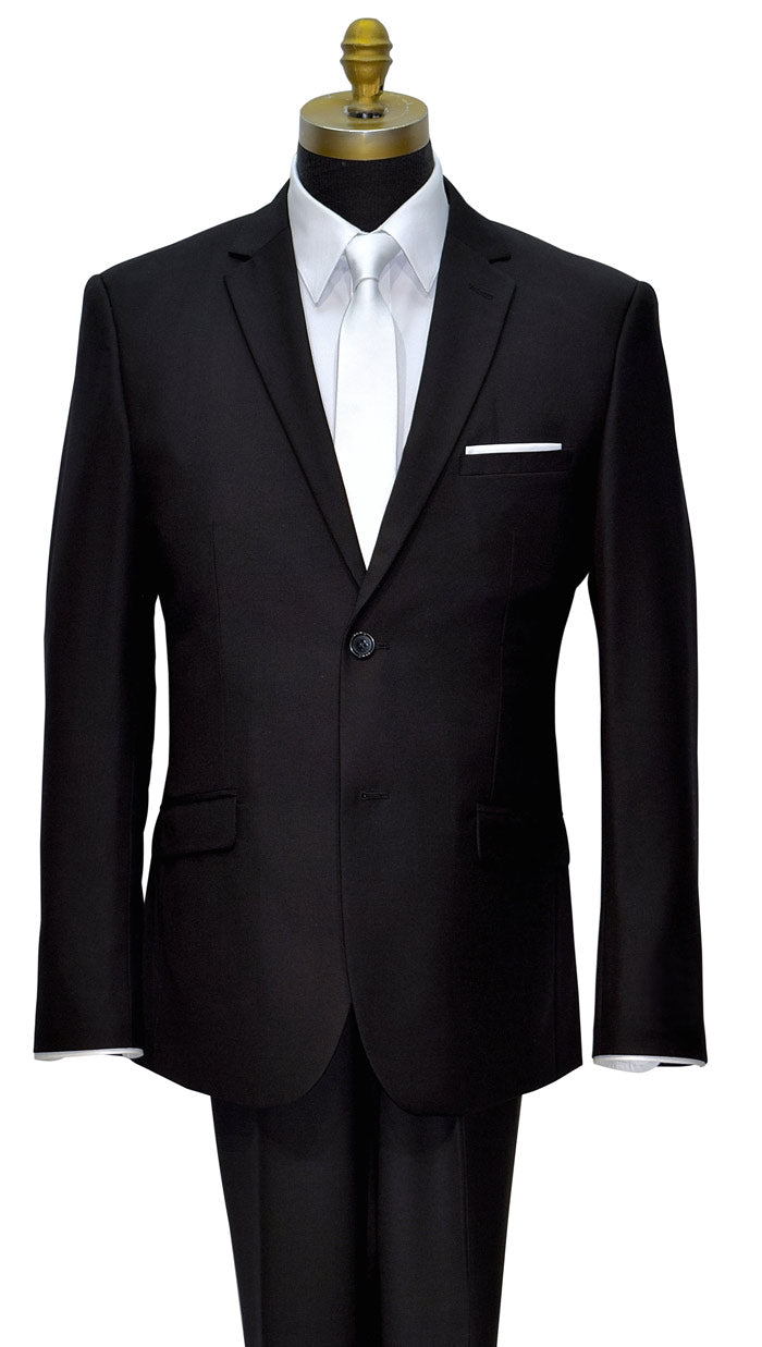Black mens suit with white shirt and a white skinny satin necktie on a mannequin against a white background